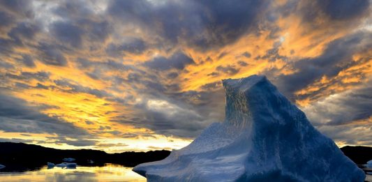 Iceberg in sunset, by Ole J. Petersen